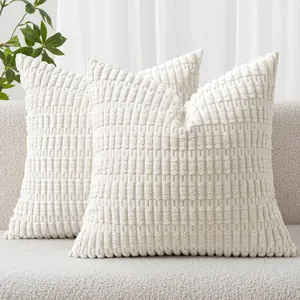 Detailed texture of white corduroy pillow covers with a vertical wheat ear pattern