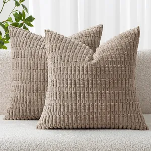 Detailed view of beige ribbed corduroy throw pillow covers featuring a wheat ear pattern.