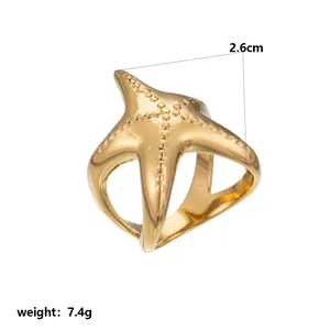 Detailed close-up view of a gold starfish ring showing 2.6cm size and 7.4g weight