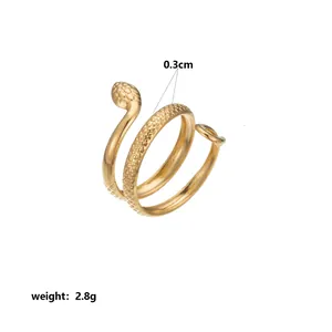 Detail view of gold stainless steel snake ring with scale texture and weight info