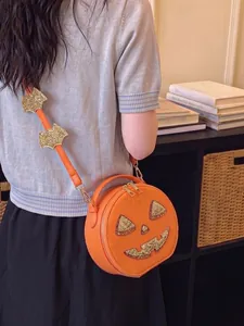 Creative Halloween pumpkin crossbody bag with glittery gold bat strap decorations