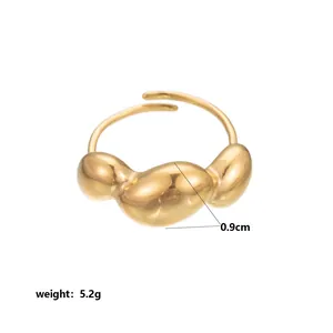 Detailed view of a gold stainless steel organic geometric ring weighing 5.2g.