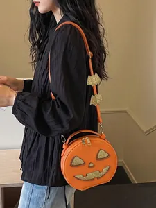 Creative Halloween pumpkin crossbody bag worn by a model in a casual setting