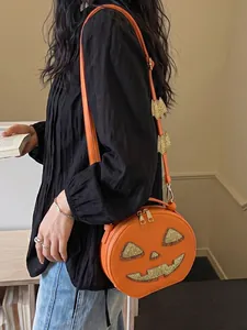 Creative orange pumpkin-shaped crossbody bag with glitter jack-o'-lantern face for Halloween