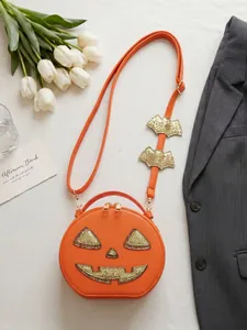 Detailed view of the creative Halloween pumpkin crossbody bag with glittery bat accents.