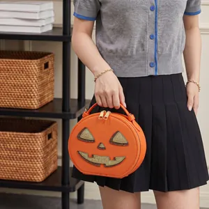 Creative Halloween pumpkin shaped circular crossbody bag with cute smiling face design