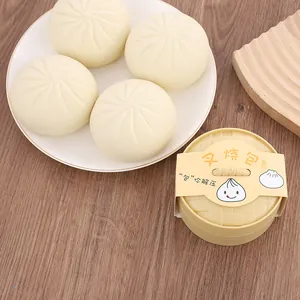Macro view of simulation steamed bun squishy toys with a decorative mini steamer