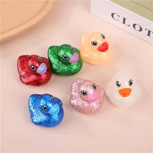 Detailed view of six colorful glittery vinyl rubber ducks for children bath time fun