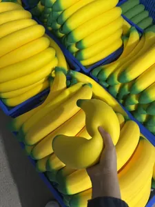 Close-up of a giant slow rebound banana squishy being squeezed for adult stress relief