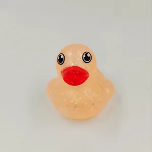 Close-up detail of a translucent glitter rubber duck bath toy for kids' water play.