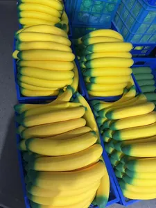 Bulk yellow and green jumbo slow rebound simulation banana stress relief squishies in crates.