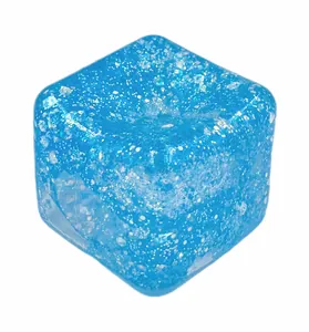 Detailed close-up view of a blue square ice cube squishy toy with sparkling silver glitter