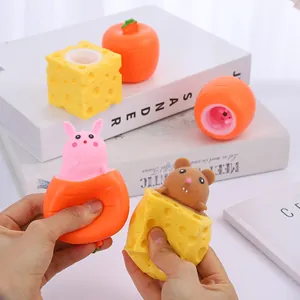 Detail showing hands squeezing TPR cheese mouse and carrot rabbit stress relief toys.