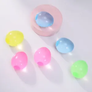 Colorful semi-transparent egg-shaped squeeze toys with maltose-like texture on white background