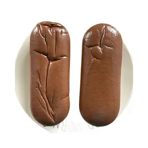 Close-up of two realistic soft PU simulation chocolate French bread loaves on plate