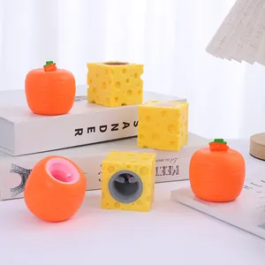 Detailed view of vibrant cheese and carrot squeeze toys with hidden mouse and rabbit characters