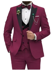 Detail of slim-fit burgundy three-piece suit with black peak lapels and bow tie