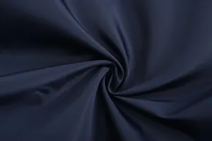 Macro view of navy blue breathable sports fabric texture for men's jacket