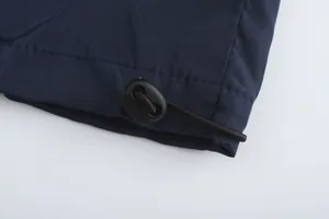 Detail of adjustable drawstring hem on navy blue breathable sports jacket for men