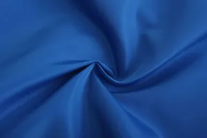 Macro view of blue breathable polyester fabric texture for men's thin sports jacket