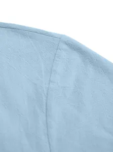 Detailed close-up showing shoulder seam and breathable cotton linen fabric of a blue shirt