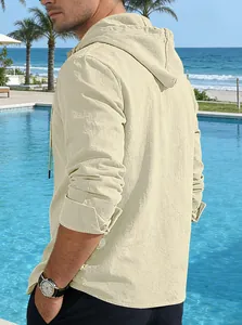 Side view of a men's beige hooded linen shirt with long sleeves in a pool setting