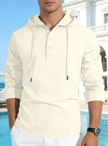 Close-up of beige linen hooded shirt showing buttoned Henley neckline and drawstring.