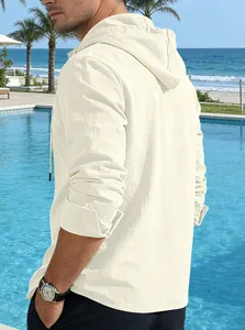 Back view of a casual beige linen hooded shirt for men in a poolside vacation setting