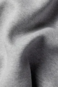 Close-up detail of soft grey heather fleece fabric texture for casual wide-leg pants