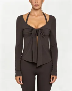 Professional front view of dark grey V-neck yoga top with stylish tie-front and long sleeves