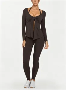 Detail view of brown long sleeve yoga set with stylish tie-front V-neck design
