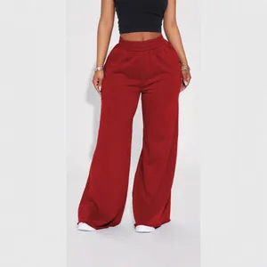 Women's comfortable red wide-leg fleece sweatpants with elastic mid-waist for winter