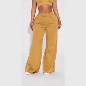 Trendy mustard yellow wide-leg fleece lounge pants with elastic waistband and raw hem