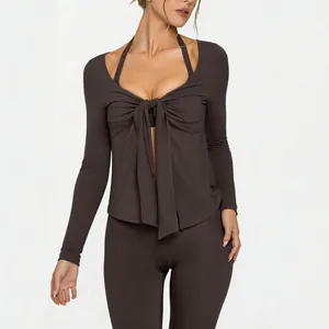 Long sleeve brown yoga jacket with deep V-neck tie front and halter neck detail