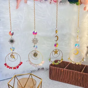 Four gold crystal suncatchers with crushed stones and celestial charms for home decor