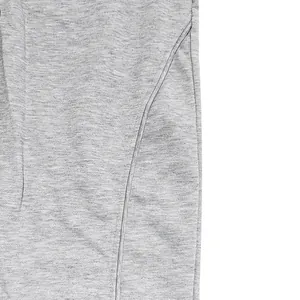 Detailed view of high-quality grey heather knit fabric and durable stitching on sweatpants