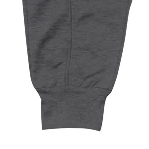 Close-up detail of ribbed cuff on dark grey American style sports sweatpants for men.