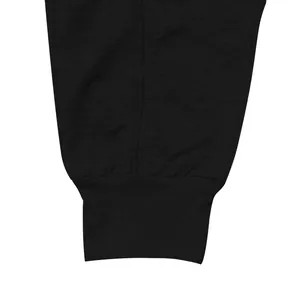 Close-up detail showing the high-quality black ribbed ankle cuff on men's sports joggers
