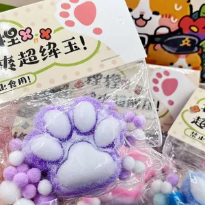 Close-up detail of the soft flocked texture on a purple cat paw squishy stress toy