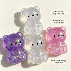 Detailed macro view of iridescent glitter bears showing soft jelly-like transparent texture.