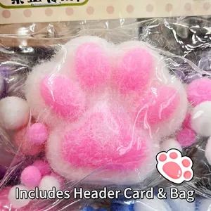 Detailed close-up of a pink and white flocked cat paw squeeze toy for stress relief