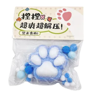 Blue and white flocked cat paw squeeze toy for stress relief in original packaging