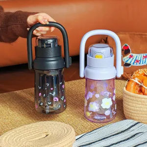 Two portable large-capacity plastic water bottles with handles in black and purple