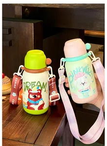 Detailed view of two cute insulated water bottles for kids with animal prints and wide straps.