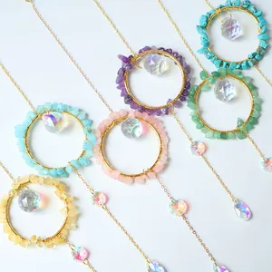 Detailed view of multiple colorful suncatchers showing various stone chips and crystals