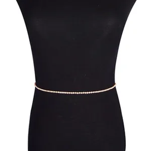 Elegant rose gold waist chain featuring shimmering crystals displayed on a black torso mannequin