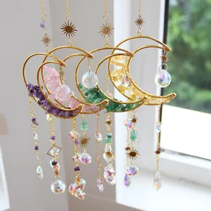 Detailed view of four colorful crystal moon suncatchers featuring natural crushed stones.