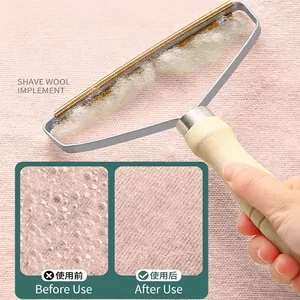 Quitapelusas manual con mango de madera para abrigos de lana y cuidado de prendas