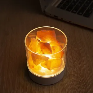 Warm glow Himalayan salt rock lamp in a glass jar for cozy bedside ambient lighting