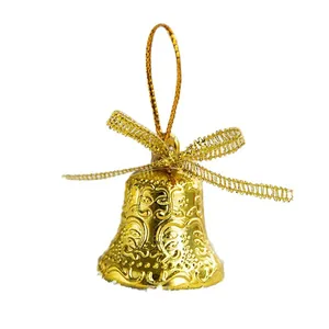 Elegant decorative gold Christmas tree bell ornament with metallic bow and hanging loop